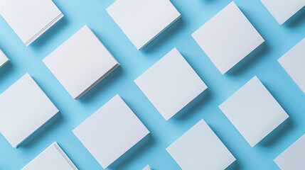 Photo of blank business cards arranged in rows on a blue textured paper background. A mock-up for branding identity, suitable for graphic designers' presentations and portfolios.