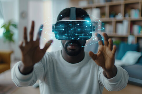 African American man wearing a VR headset interacts with a digital environment, demonstrating the capabilities of spatial technology and augmented reality. 