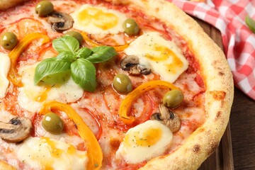Delicious vegetarian pizza on wooden table, closeup