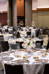 Formal Dining Arrangement with Floral Centerpieces

