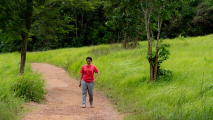 Portrait of Asia women walking on the meado
