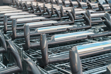 Supermarket trolleys lined up in a row