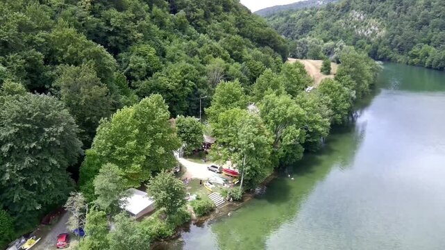 Aerial view of Kolpa River (Gorenjci pri Adle&scaron;ičih) in Slovenia (M) Specs: 4K-30fps | 45Mbps Keywords: #4K, #QHD, #drone, #background, #river, #trees, #forest, #grassfield - DATE: June 23th, 2024