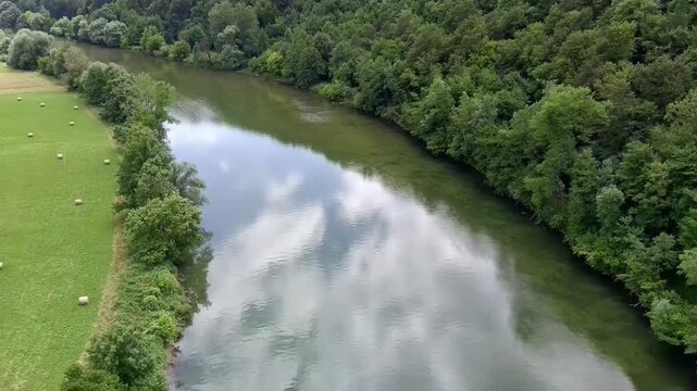 Aerial view of Kolpa River (Gorenjci pri Adle&scaron;ičih) in Slovenia (J) Specs: 4K-30fps | 45Mbps Keywords: #4K, #QHD, #drone, #background, #river, #trees, #forest, #grassfield - DATE: June 23th, 2024