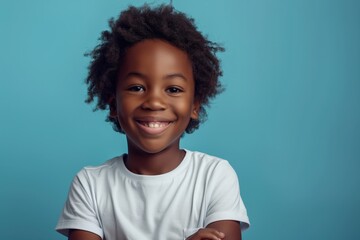 happy black boy wearing white t-shirt, in the style of mockup, blue background