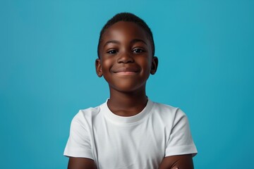 happy black boy wearing a white t-shirt in the style of a mockup, on a blue background