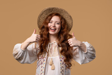 Positive woman with hand sign like, thumbs up gesture. Lady on beige background