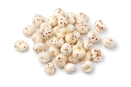 Heap of puffed Lotus seed, Makhana, isolated on white background close up