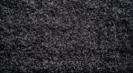 Fototapeta premium Black background, dark gray color, rough texture of the felt fabric