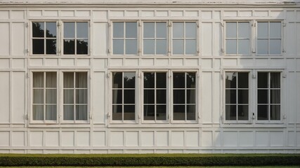 Fototapeta premium vintage white theme house with square windows for back background