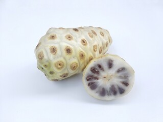 Morinda citrifolia Fresh Noni fruit isolated on white background 