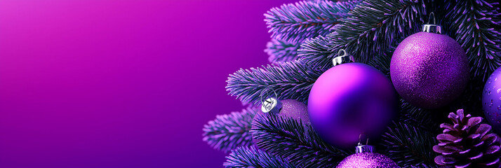 Christmas tree branch with violet bauble is reflecting on a wet surface with a bokeh effect on...