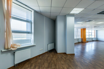 panorama view in empty modern office hall with sunlight in windows.