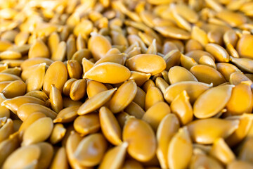 Seeds background. Yellow pumpkin seeds