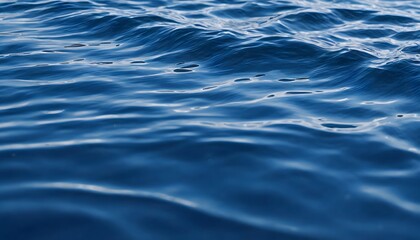 Blue ocean surface background. Serene water texture with soft ripples and summer vibes.
