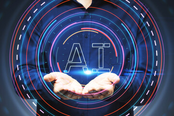 Hands holding AI symbol with futuristic graphic elements on dark background.