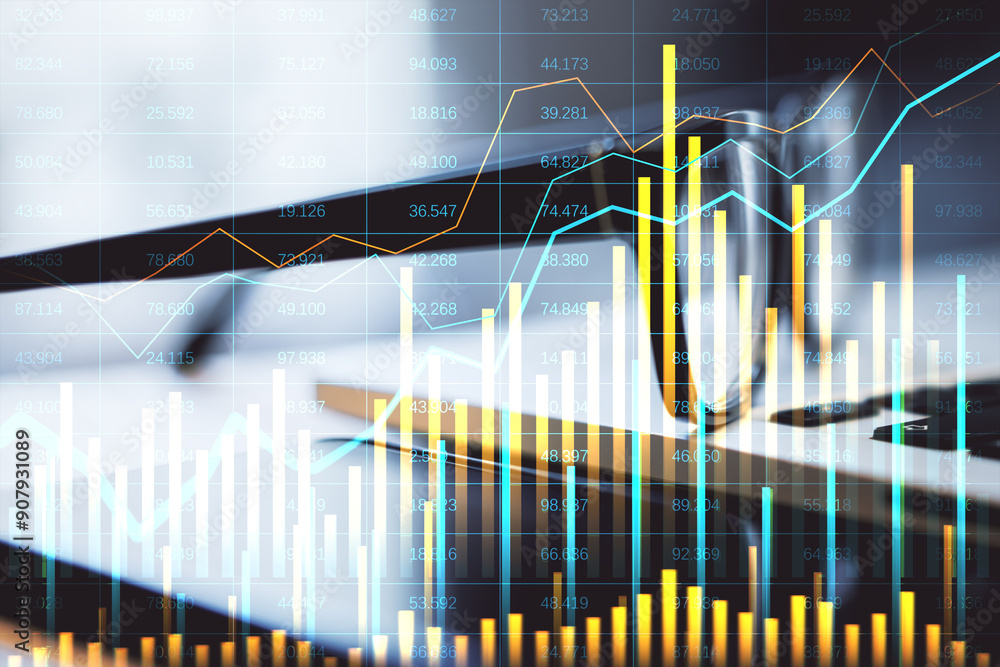 Poster financial charts and graphs overlaying a laptop screen on a desk.
