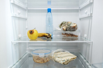 Moldy meal wrapped in cling film in the refrigerator. Incorrect storage, spoiled product, expired...