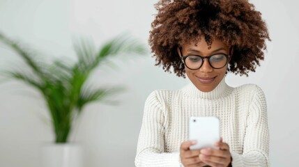 A candidate checking their phone for a response to a follow-up email in a cozy cafe