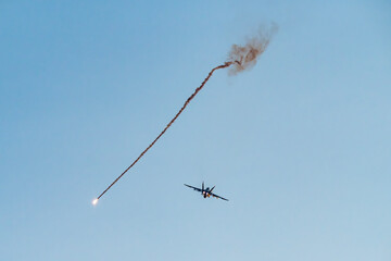 Fighter jet firing flares during the Pitch Black Exercise 2024 at Mindil Beach in Darwin.