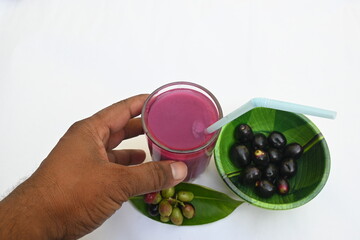 Syzygium cumini fruits juice. Its other names Malabar plum, Java plum, black plum, jamun and  jambolan. This fruit have anti diabetic properties. Indian jamun juice. Healthy drink. Fruit juice.