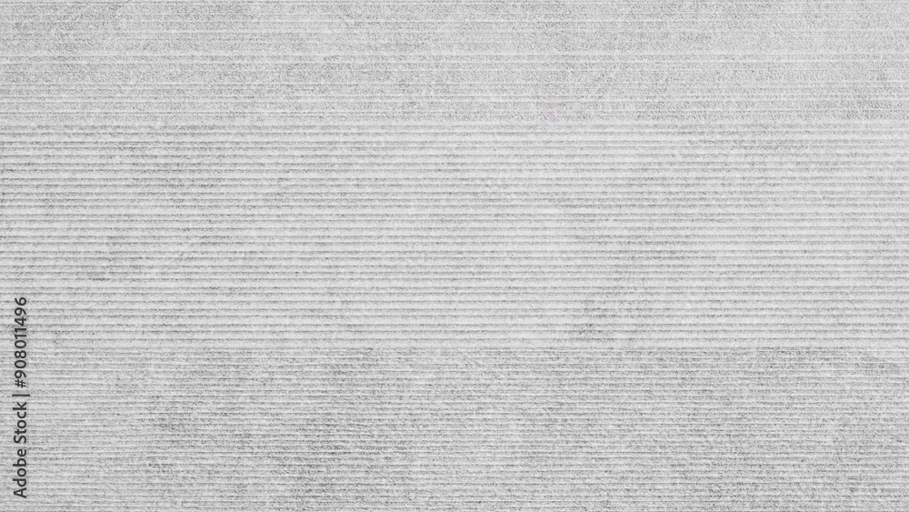 Poster a grey and white striped wall with a lot of texture. the wall is very plain and has a lot of lines a