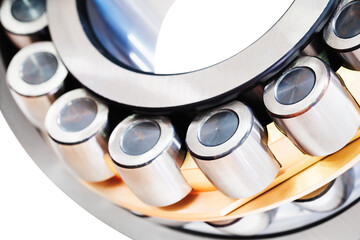 A silver and gold bearing. The bearing is made of metal and has a shiny surface, Industrial concept