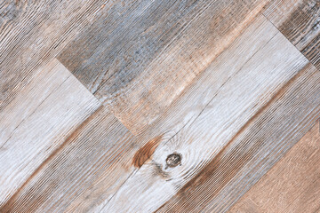Fototapeta premium A wooden plank with a grainy texture. The wood is light brown in color. The grain of the wood is visible, and it is a natural wood
