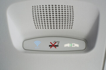 Group of Air control knobs in a new plane, Wi-Fi is included, light for belt warning signals and no smoking on the plane