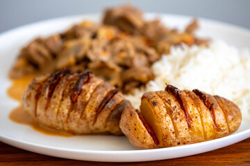 Traditional filet mignon stroganoff with rustic potatoes