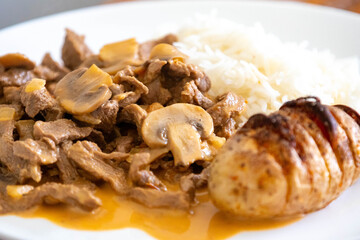 Traditional filet mignon stroganoff with rustic potatoes