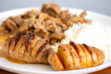 Traditional filet mignon stroganoff with rustic potatoes