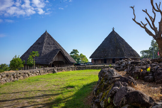 Traditional Sasak village with thatched roof houses in Lombok, Indonesia. This image portrays the cultural and architectural heritage of the Sasak people, perfect for articles on culture and history.