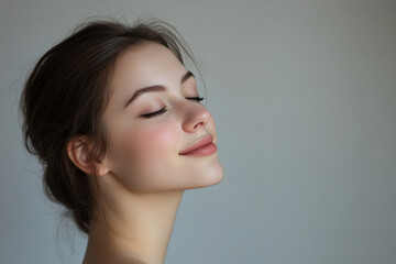 Naklejka premium A close up of a girl's face with her eyes closed