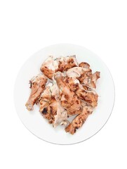 Grilled chicken cut into pieces is placed on a plate. on a white background