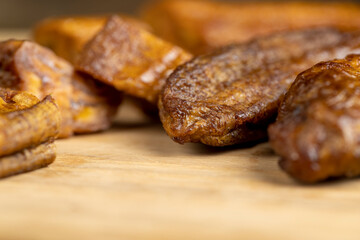 dried small bananas on a wooden board