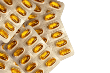 Top view of several tablets of soft capsules on top of each other.White or transparent background. Supplement softgels. Ascorbic acid. 
