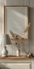 Blank digital photo frame on a cozy nightstand, with a bedside lamp and a stack of books to set a cozy ambiance in the room.