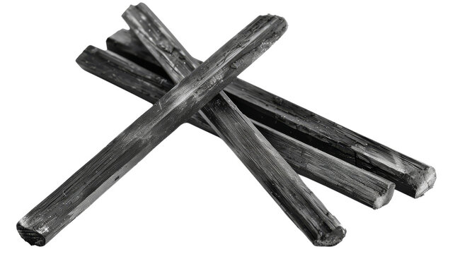 A group of four black sticks arranged in an X shape, creating a simple but striking visual.