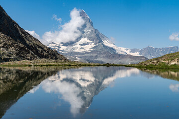 Riffelsee Lake and Matterhorn mountain in the Alps with reflection. Alpine scene in Switzerland