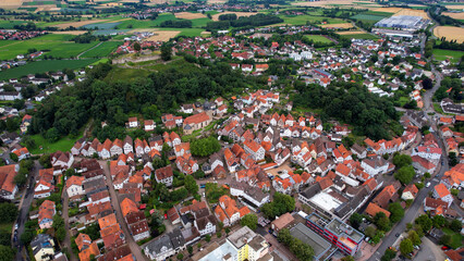 Aerial panorama view around the old town of the city Gudensberg in Germany on a summer day afternoon.	