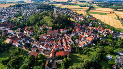 Aerial panorama view around the old town of the city Felsberg in hessen in Germany on a summer day afternoon.	