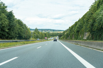 High-speed road with moving cars. Autobahn and cars.