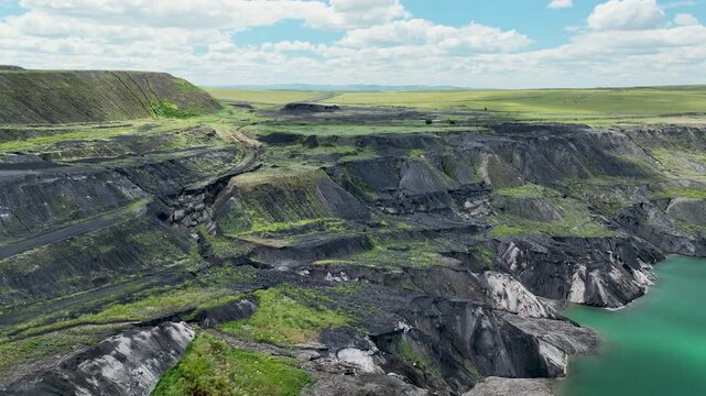 An abandoned flooded coal mine in the steppe.