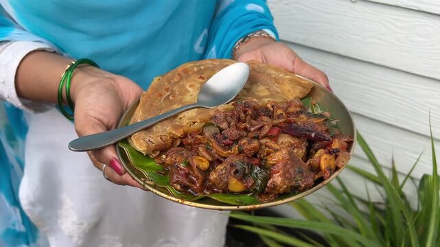 Close up shot of Sukha mutton and paratha.