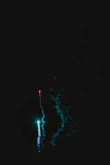 Captivating image of colorful fireworks streaking through the dark night sky, leaving vibrant...