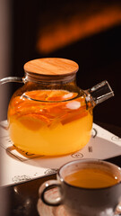 teapot with orange tea