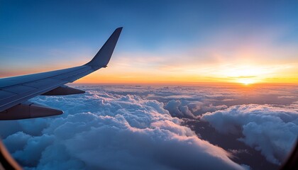 An airplane wing cutting through the clouds, with a breathtaking sunrise or sunset in the background