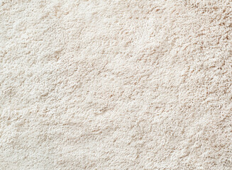 Closeup of soft beige shag rug texture for interior design