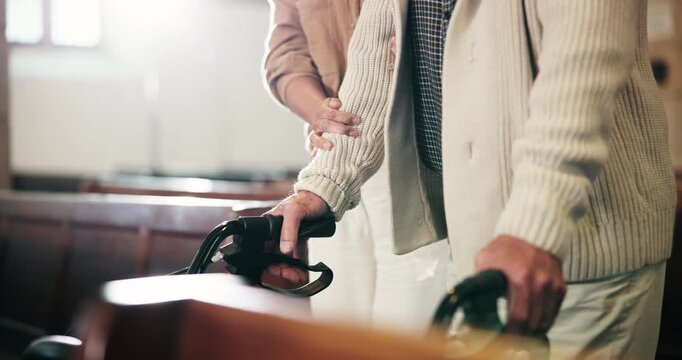 Senior, man and walking with caregiver in church for walker assistance, religion or christian service. Elderly person, woman or mobility support in chapel for spiritual sermon and faith to praise God